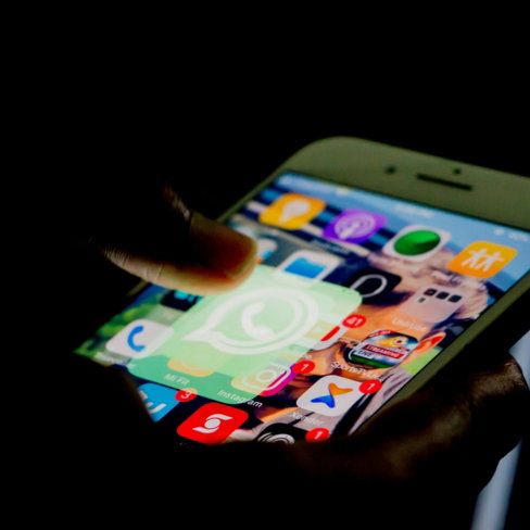 person-holding-i-phone.jpg person holding iPhone